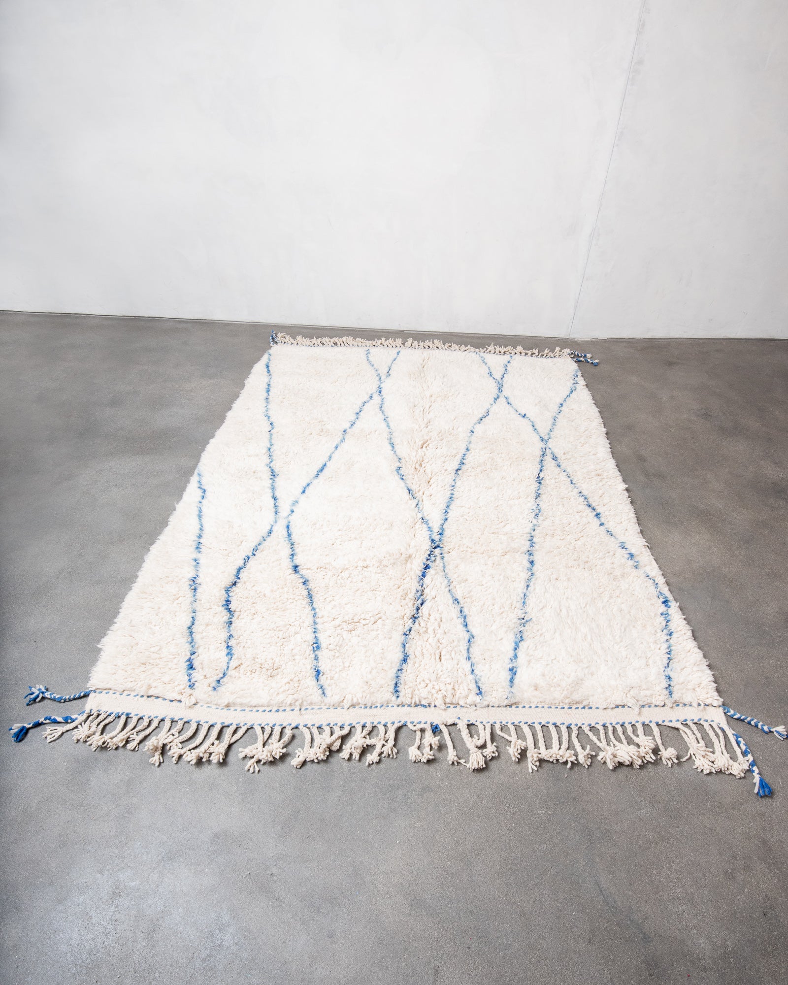 Modern, designer, handcrafted Berber rug from Morocco. Beniourain carpet with beautiful colours and patterns and fluffy wool texture.